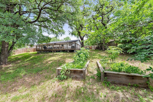 1302 Astor Pl, Austin, TX 78721 - view of yard featuring a garden and a deck