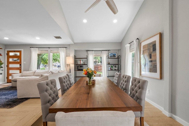 1302 Astor Pl, Austin, TX 78721 - dining area with baseboards, wood finished floors, lofted ceiling, ceiling fan, and recessed lighting