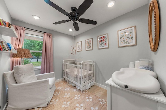 1302 Astor Pl, Austin, TX 78721 - bedroom with a nursery area, baseboards, recessed lighting, light wood finished floors, and a ceiling fan