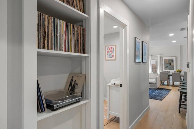 1302 Astor Pl, Austin, TX 78721 - hallway featuring light wood-style flooring, recessed lighting, and baseboards