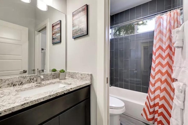 full bathroom featuring toilet, vanity, and shower / bath combo