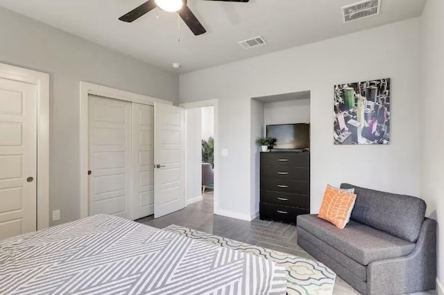 bedroom featuring a closet, baseboards, and a ceiling fan