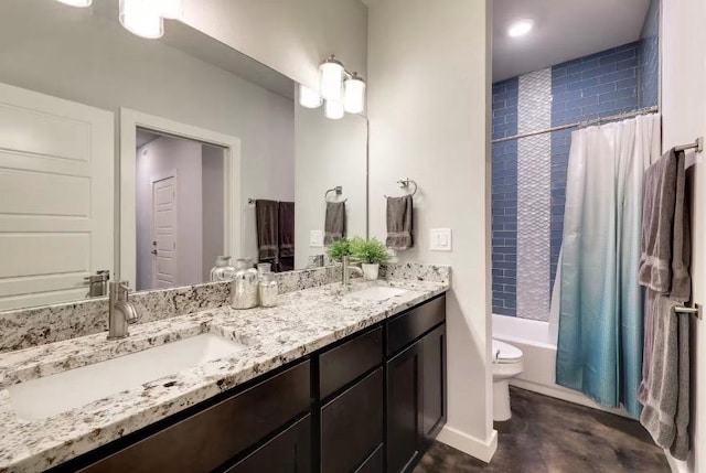 full bath featuring toilet, shower / bath combo, and double vanity
