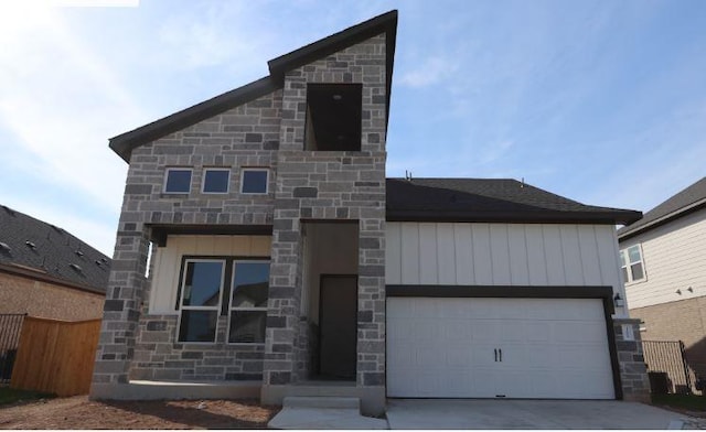 11804 Shimmering Sea Dr, Austin, TX 78747 - contemporary home with stone siding, driveway, fence, and an attached garage