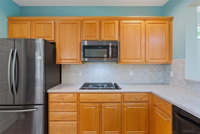 138 Dewberry Dr, Georgetown, TX 78633 - kitchen featuring black appliances, backsplash, and light countertops
