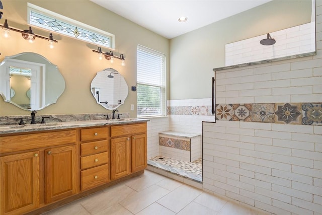 138 Dewberry Dr, Georgetown, TX 78633 - bathroom featuring double vanity, tile patterned flooring, and walk in shower