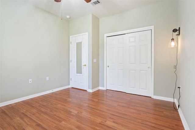 138 Dewberry Dr, Georgetown, TX 78633 - unfurnished bedroom featuring light wood-style floors, baseboards, a ceiling fan, and a closet