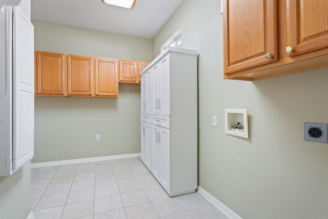 138 Dewberry Dr, Georgetown, TX 78633 - laundry room with hookup for an electric dryer, cabinet space, washer hookup, light tile patterned floors, and baseboards