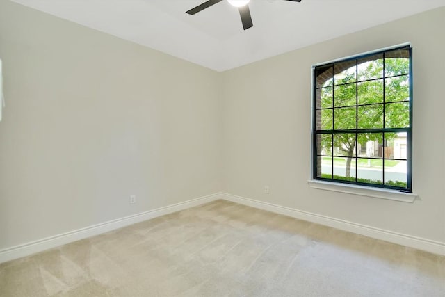 441 Cascada Ln, Round Rock, TX 78681 - unfurnished room featuring a ceiling fan, light carpet, healthy amount of natural light, and baseboards