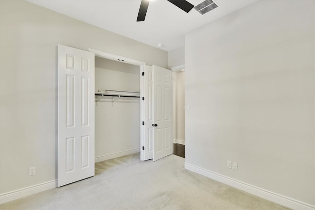 441 Cascada Ln, Round Rock, TX 78681 - unfurnished bedroom featuring baseboards, light colored carpet, a closet, and a ceiling fan