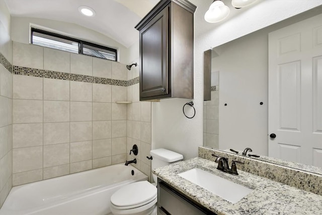 bathroom featuring bathing tub / shower combination, toilet, and vanity
