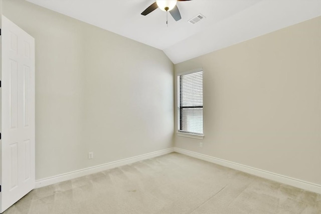 unfurnished room with ceiling fan, baseboards, light colored carpet, and lofted ceiling