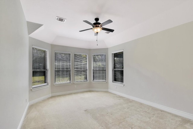 unfurnished room with baseboards, carpet floors, and a ceiling fan