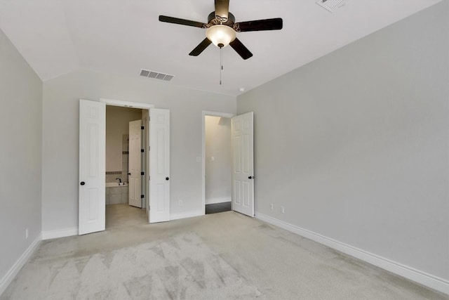 441 Cascada Ln, Round Rock, TX 78681 - unfurnished bedroom with light colored carpet, baseboards, ensuite bathroom, lofted ceiling, and ceiling fan