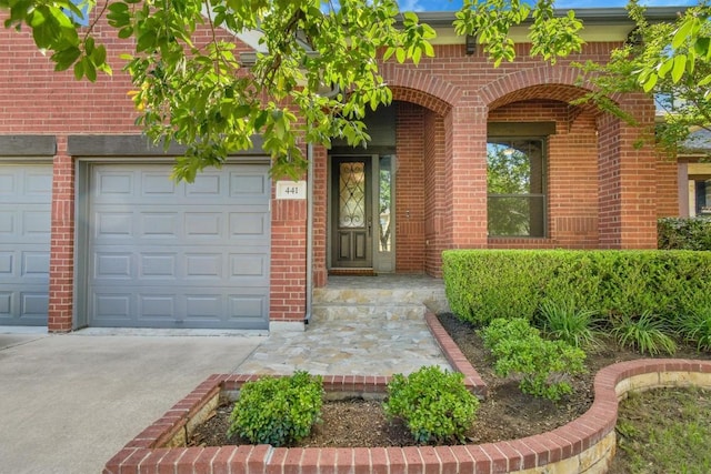 441 Cascada Ln, Round Rock, TX 78681 - view of exterior entry with concrete driveway and brick siding