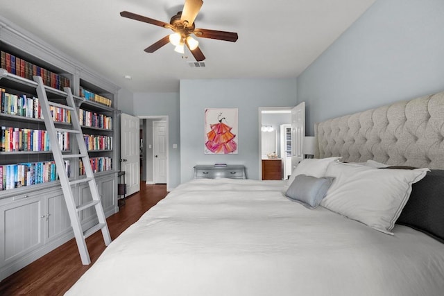 7613 Buck Meadow Dr, Georgetown, TX 78628 - bedroom with dark wood-style flooring, ensuite bath, and a ceiling fan