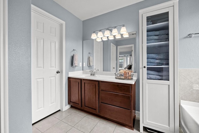 7613 Buck Meadow Dr, Georgetown, TX 78628 - bathroom with tile patterned flooring, vanity, and a bath