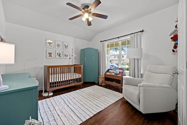 7613 Buck Meadow Dr, Georgetown, TX 78628 - bedroom featuring a crib, vaulted ceiling, wood finished floors, and a ceiling fan
