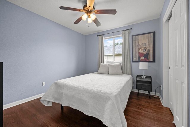 7613 Buck Meadow Dr, Georgetown, TX 78628 - bedroom with a closet, baseboards, wood finished floors, and a ceiling fan