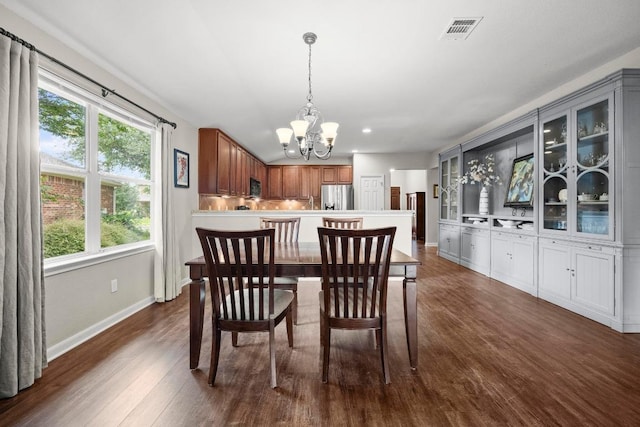 7613 Buck Meadow Dr, Georgetown, TX 78628 - dining area with a chandelier, plenty of natural light, dark wood finished floors, baseboards, and recessed lighting