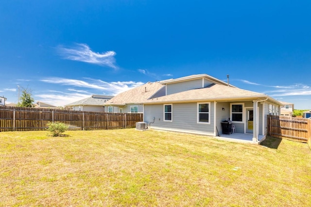 back of property with a patio area and central AC