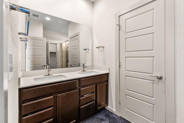 bathroom featuring double vanity
