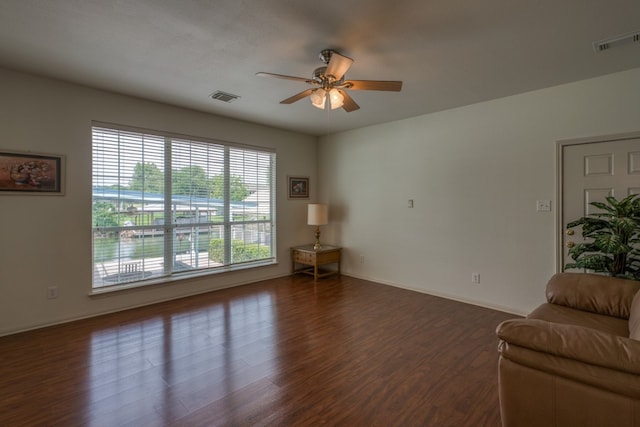 521 E Briarway Dr, Granite Shoals, TX 78654 - living room with ceiling fan, dark wood finished floors, and baseboards