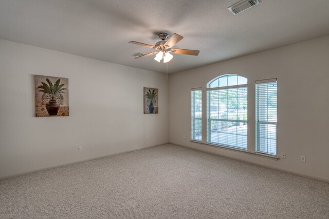 521 E Briarway Dr, Granite Shoals, TX 78654 - spare room featuring carpet flooring and a ceiling fan
