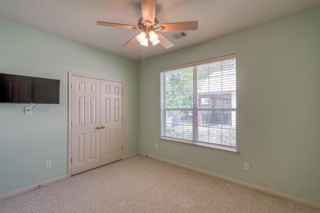 521 E Briarway Dr, Granite Shoals, TX 78654 - unfurnished bedroom with carpet floors, a closet, baseboards, and ceiling fan