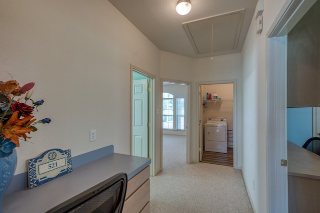 521 E Briarway Dr, Granite Shoals, TX 78654 - hallway with attic access, washer / dryer, and light colored carpet