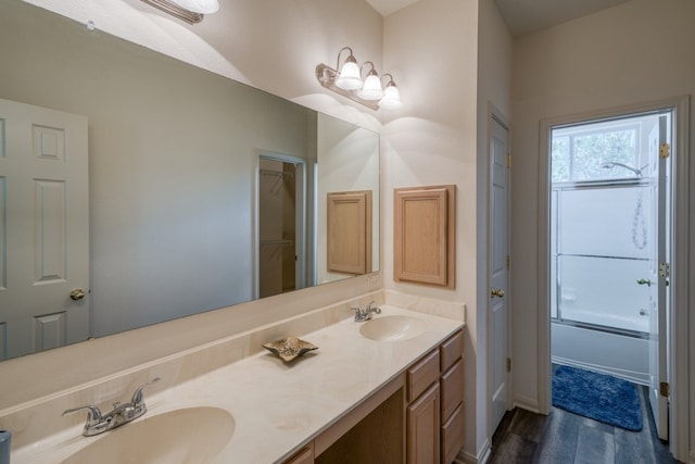 521 E Briarway Dr, Granite Shoals, TX 78654 - bathroom with wood finished floors and double vanity