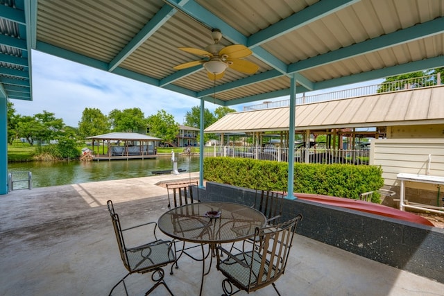 521 E Briarway Dr, Granite Shoals, TX 78654 - view of patio featuring a water view, outdoor dining space, ceiling fan, and a dock