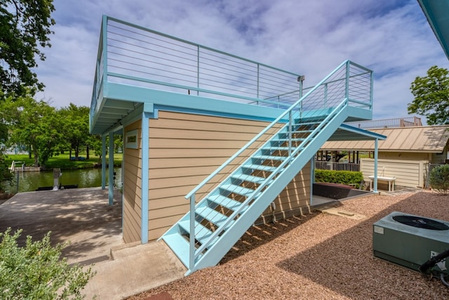 521 E Briarway Dr, Granite Shoals, TX 78654 - view of property exterior with a water view and stairs