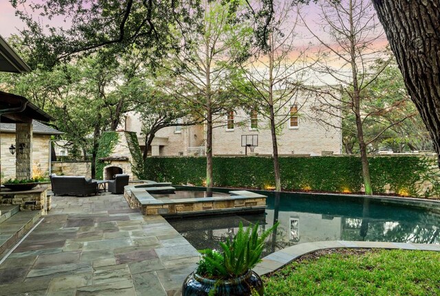 5902 Saratoga Cv, Austin, TX 78746 - view of pool featuring a patio, outdoor lounge area, and a pool with connected hot tub