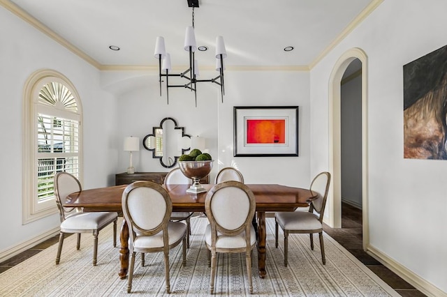 5902 Saratoga Cv, Austin, TX 78746 - dining area featuring a chandelier, ornamental molding, and arched walkways