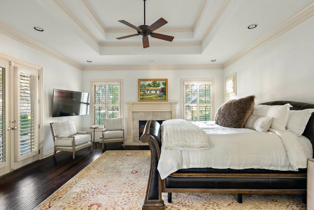5902 Saratoga Cv, Austin, TX 78746 - bedroom featuring dark wood-type flooring, a raised ceiling, a fireplace, crown molding, and access to outside