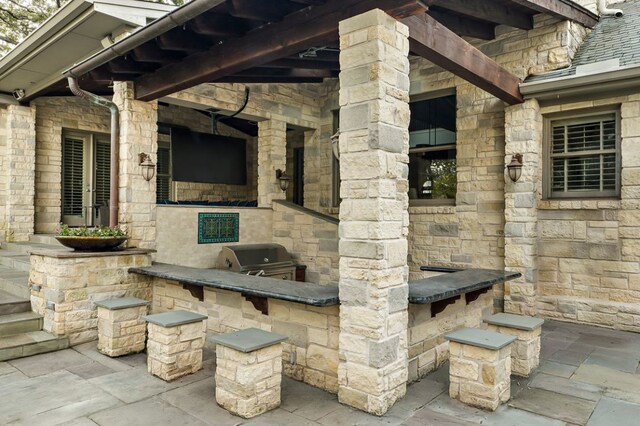 5902 Saratoga Cv, Austin, TX 78746 - view of patio / terrace featuring an outdoor kitchen
