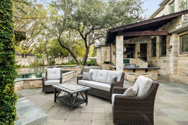 5902 Saratoga Cv, Austin, TX 78746 - view of patio featuring exterior kitchen and an outdoor living space