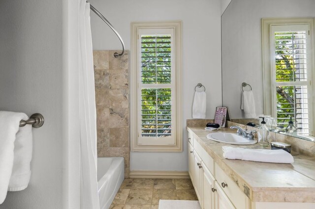 5902 Saratoga Cv, Austin, TX 78746 - bathroom featuring vanity and shower / bathtub combination with curtain