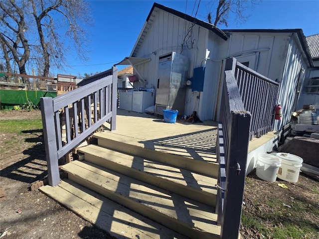1014 S 3rd St, Temple, TX 76504 - view of front of house with board and batten siding and a wooden deck