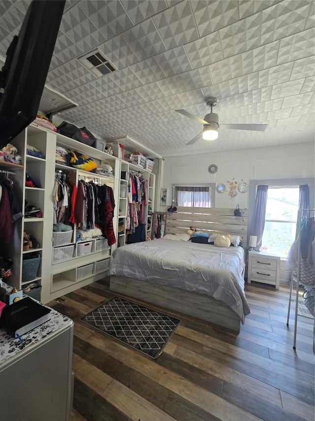 1014 S 3rd St, Temple, TX 76504 - bedroom featuring hardwood / wood-style floors, multiple windows, and a ceiling fan