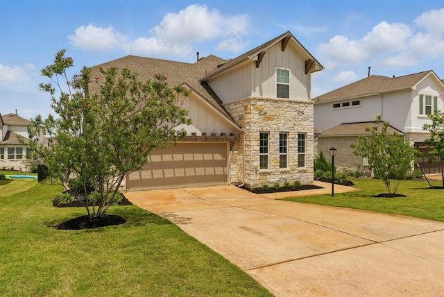 604 Buena Onda Way, Lakeway, TX 78738 - view of front facade with board and batten siding, stone siding, concrete driveway, and a front yard