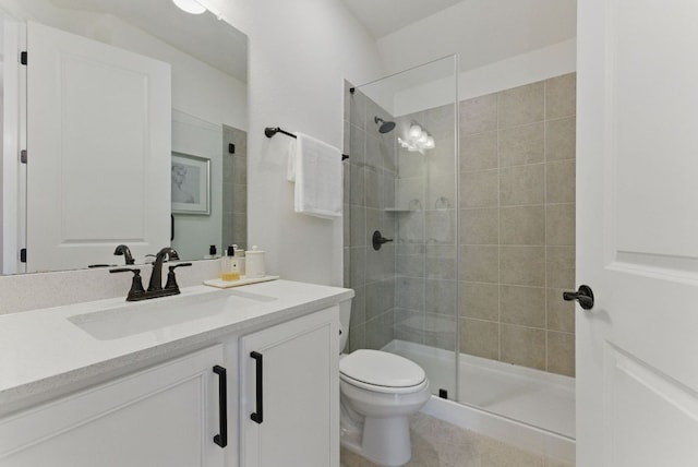 full bathroom with tiled shower, toilet, vanity, and tile patterned floors