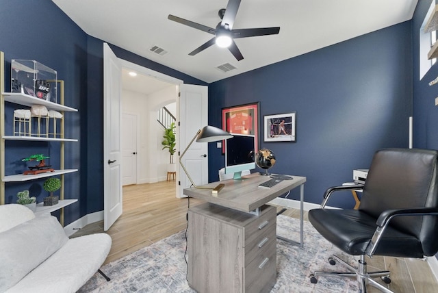office area featuring wood finished floors, ceiling fan, and baseboards