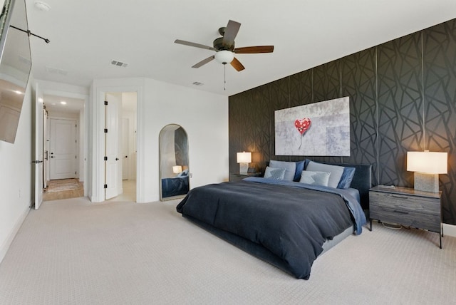 604 Buena Onda Way, Lakeway, TX 78738 - carpeted bedroom with an accent wall, wallpapered walls, and a ceiling fan