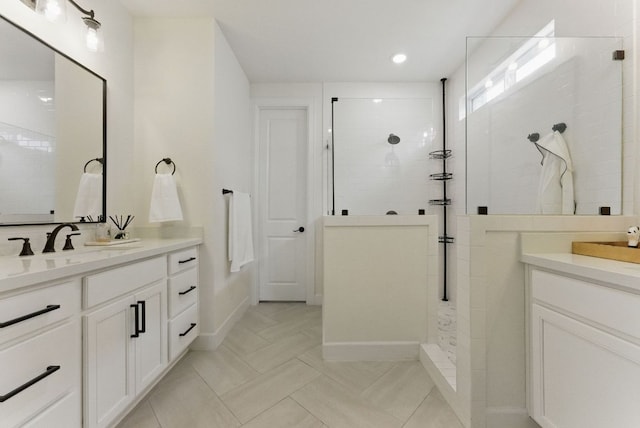 604 Buena Onda Way, Lakeway, TX 78738 - bathroom featuring two vanities, walk in shower, recessed lighting, and tile patterned flooring