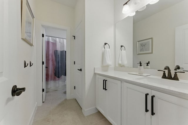 full bathroom with tile patterned flooring, vanity, baseboards, and curtained shower