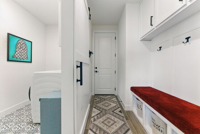 mudroom featuring baseboards