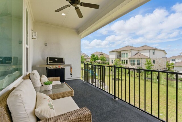 balcony featuring a residential view, a ceiling fan, and a grill