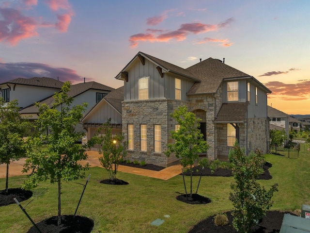 604 Buena Onda Way, Lakeway, TX 78738 - back of property with board and batten siding, stone siding, and roof with shingles